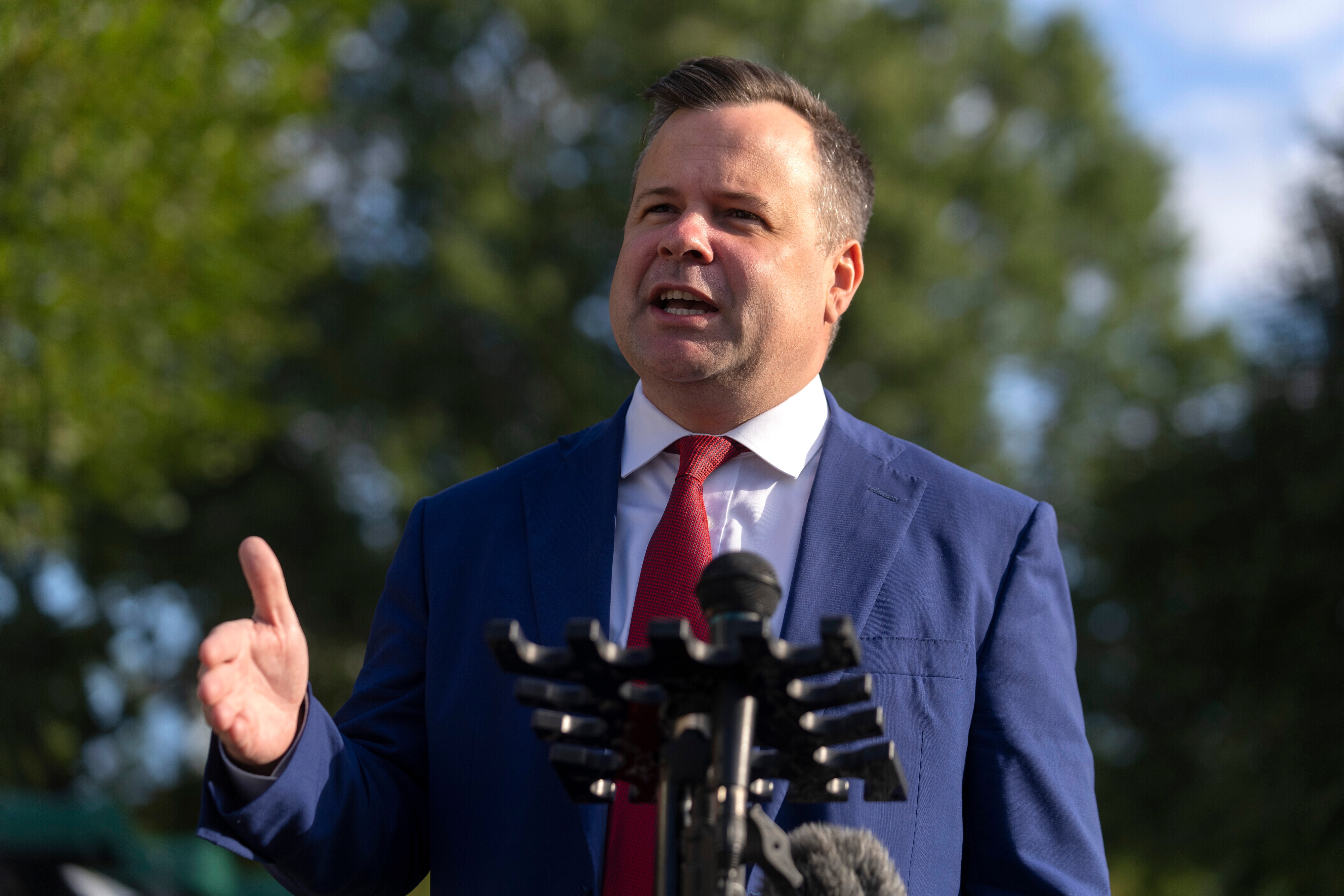 Bill Pulte speaking at a podium