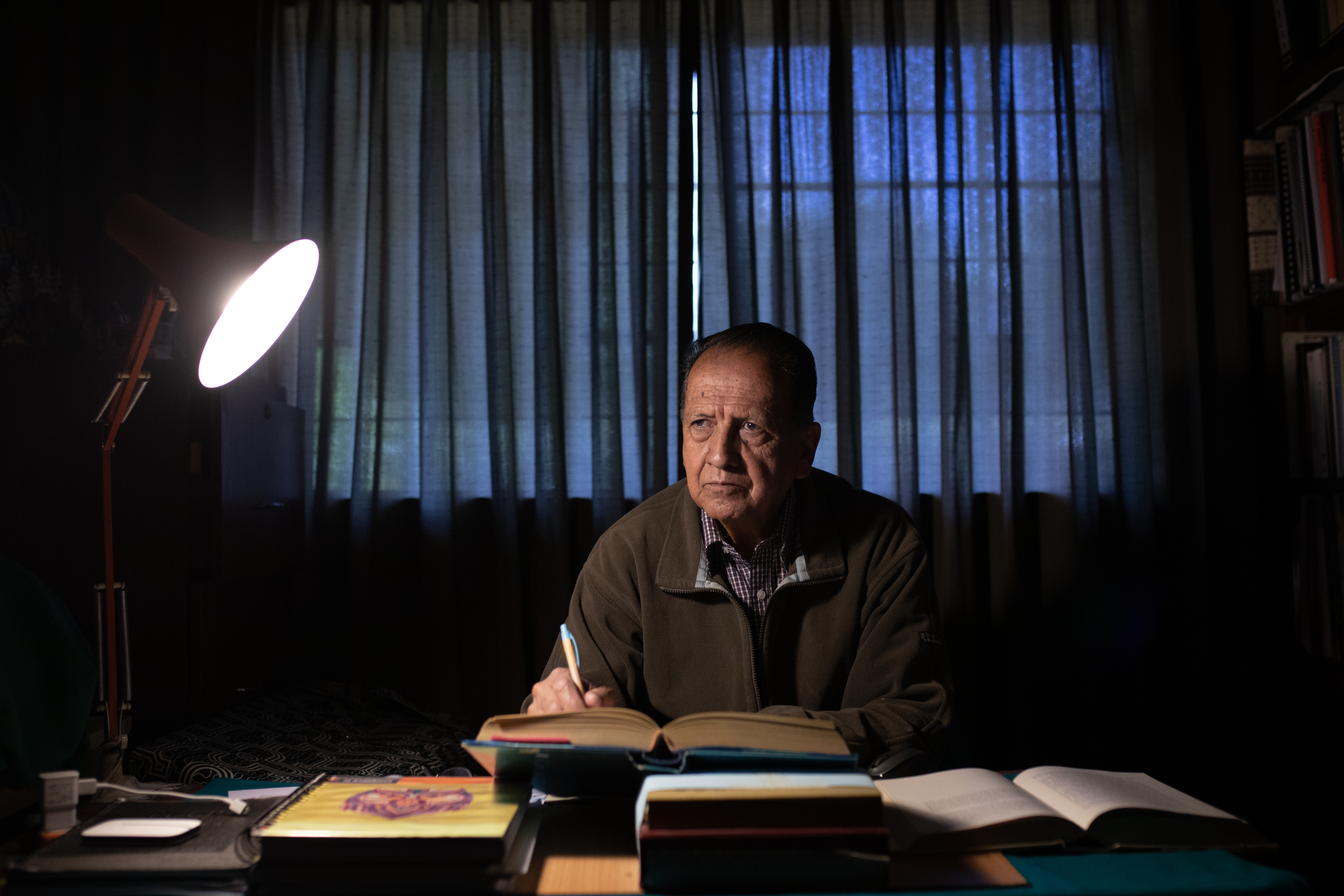 Cesar Portocarrero, shown at his office, contributed to a 2016 study that modeled how a glacial lake outburst flood at Laguna Palcacocha might unfold.