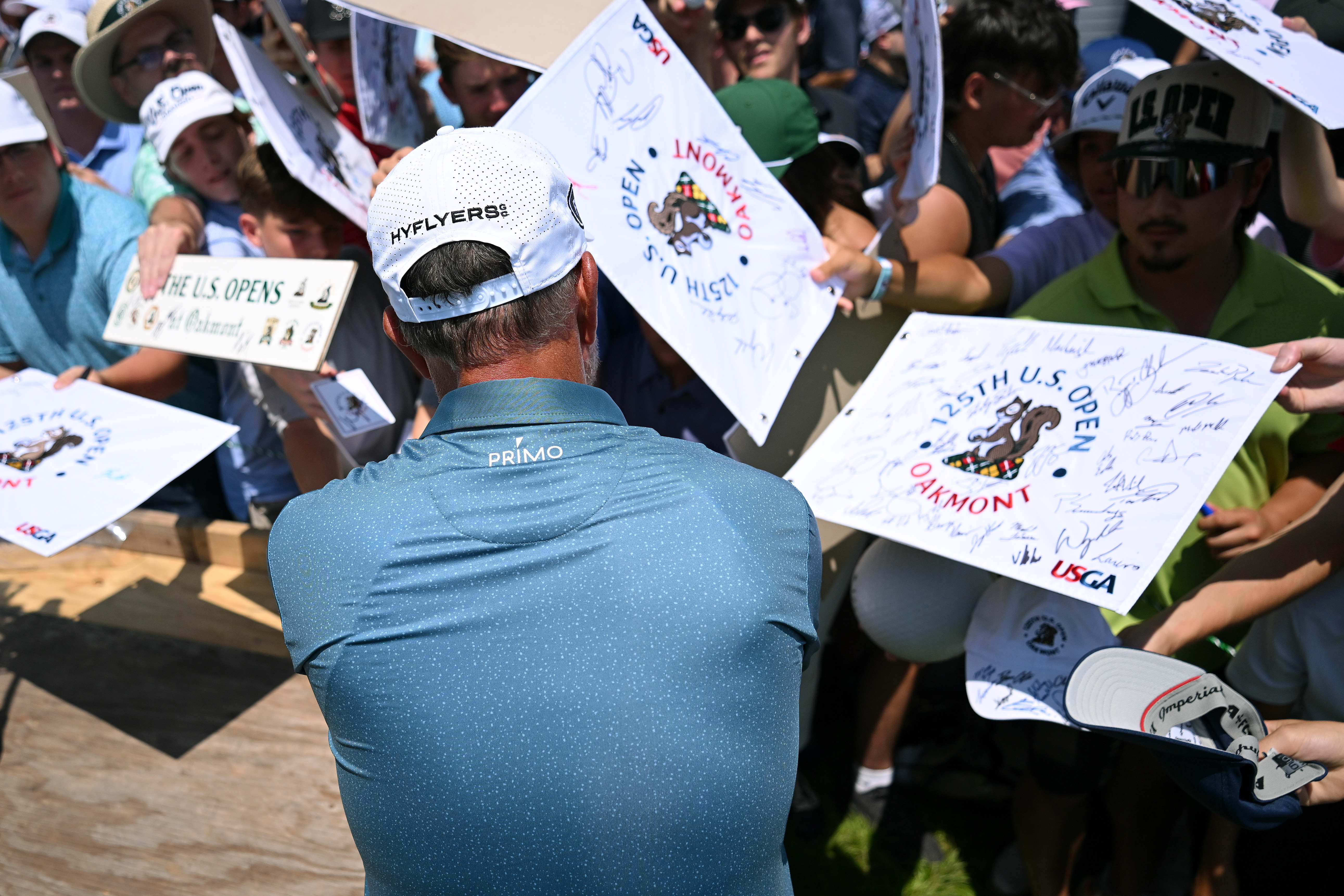 Phil Mickelson waves to fans at Oakmont