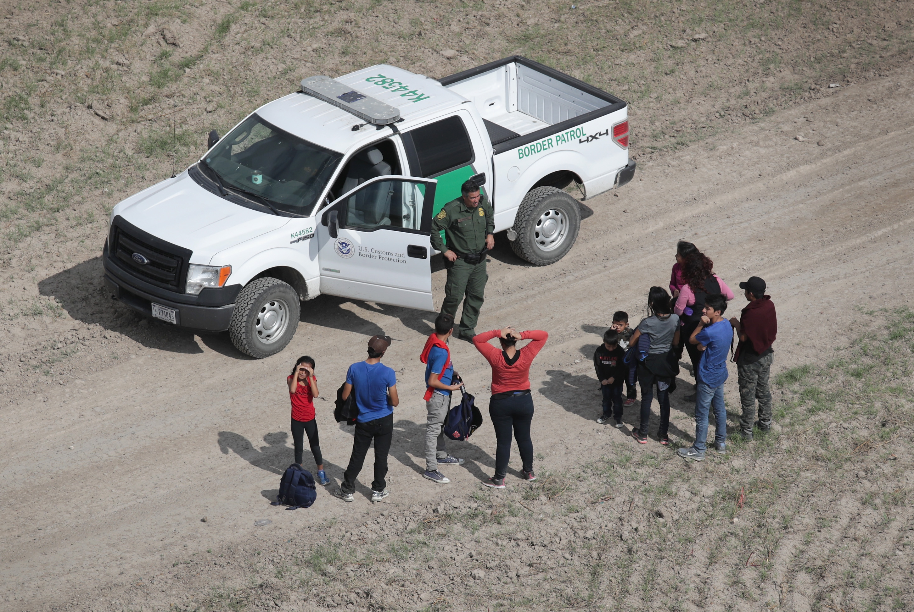 Trump administration tightens immigration asylum rules as caravans approach