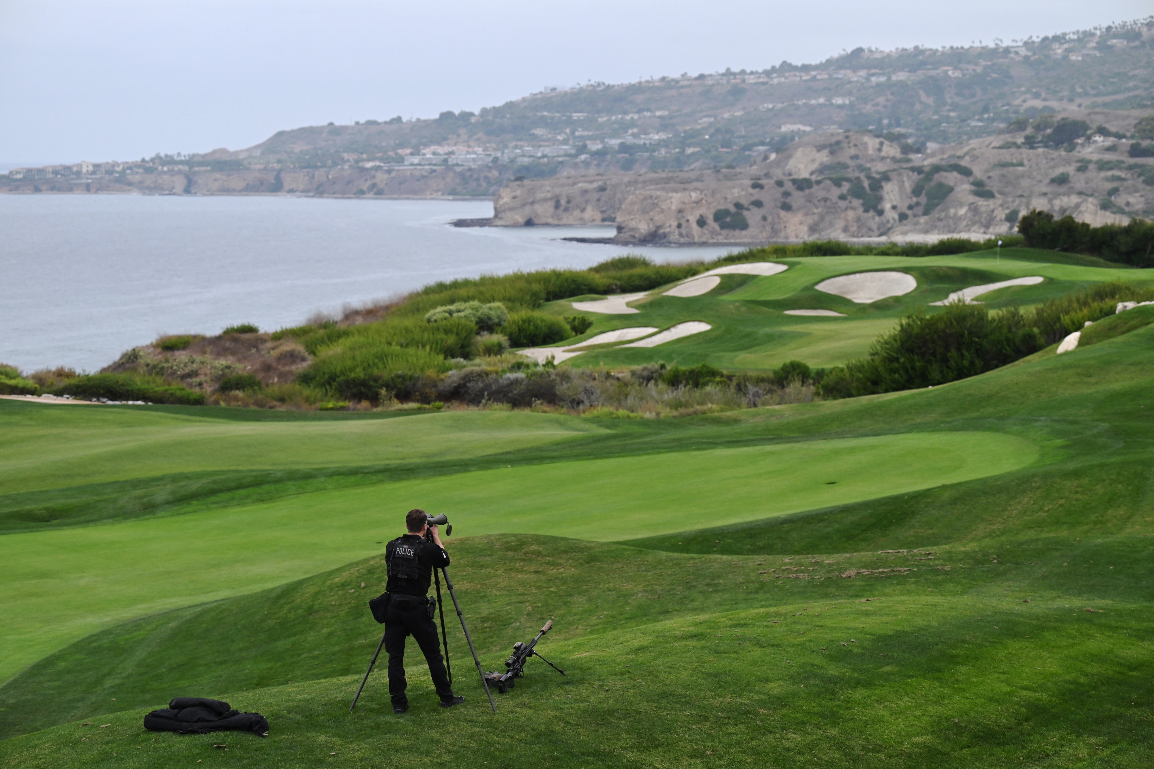 Armed man arrested at Trump golf course near Los Angeles; authorities say he had ammunition and was apparently monitoring security.