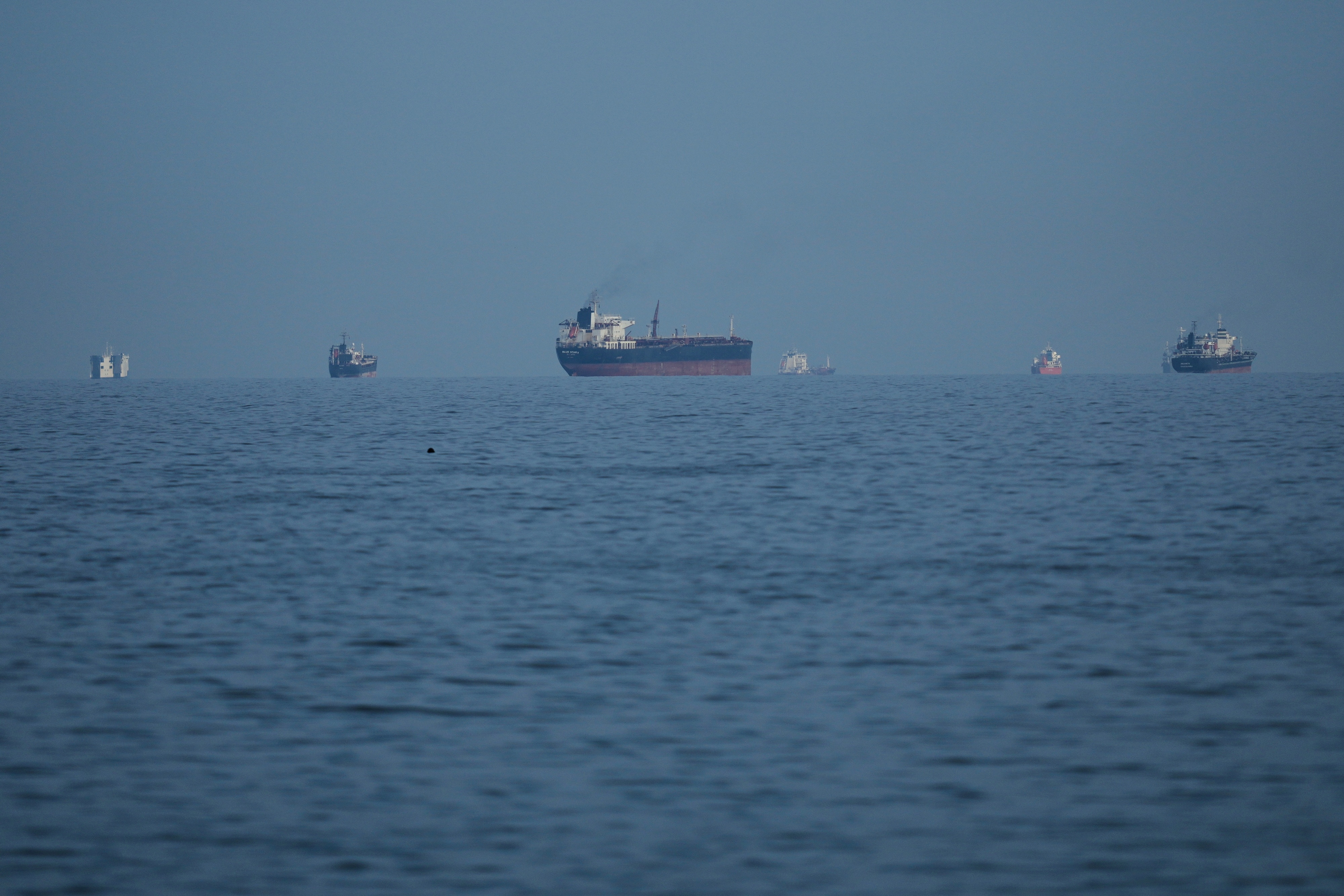 Cargo ships navigating the crucial Persian Gulf shipping lane